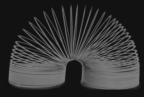 A slinky bent over to form an arch
